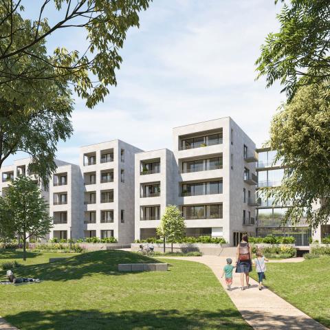 Langs de kant van de treinsporen komen er appartementen.